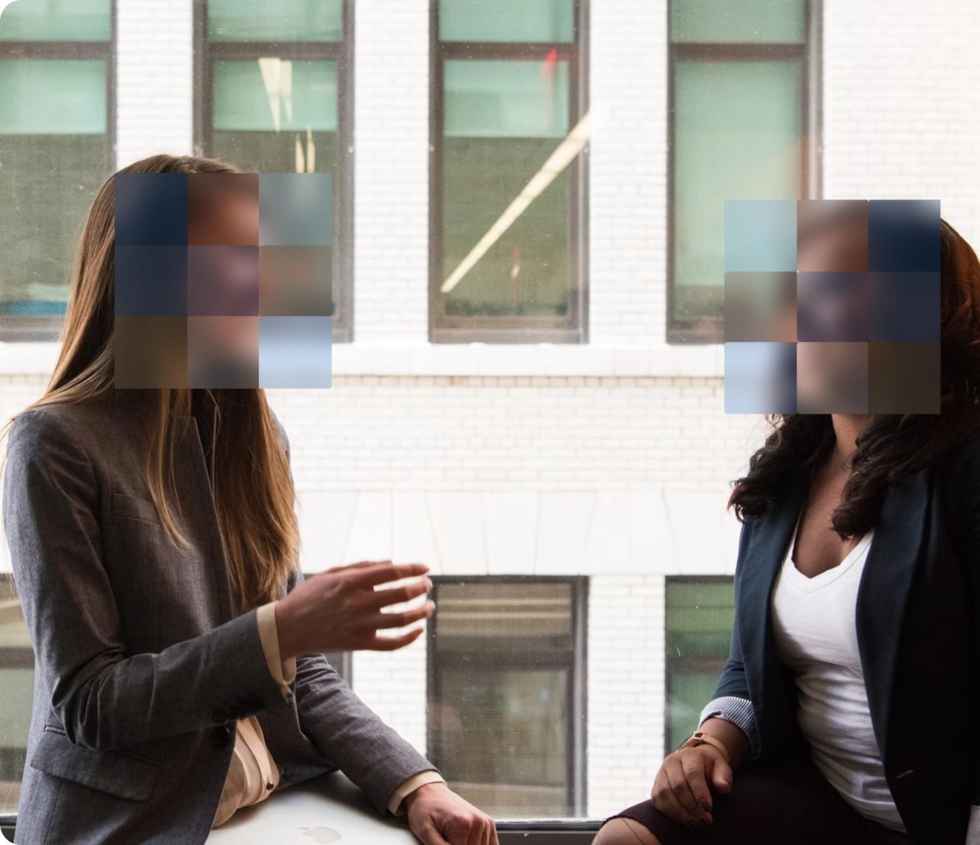Blurred faces of women talking